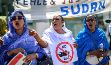 Women shout slogans as they take part in a demonstration on the opening day of Sudan ceasefire talks in Geneva, on August 14.