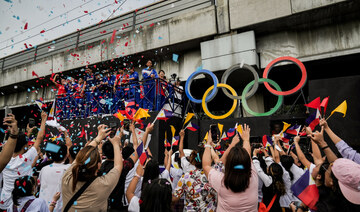 Filipino gymnast Carlos Yulo joins a welcoming parade for Filipino athletes who competed at the Paris 2024 Olympics, in Manila.