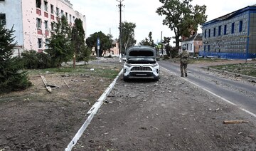 A Ukrainian soldier walks on a damaged street in the Ukrainian-controlled Russian town of Sudzha, Kursk region.