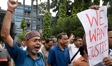 Medical professionals shout slogans during a protest to condemn the rape and murder of a doctor, at the Calcutta Medical College