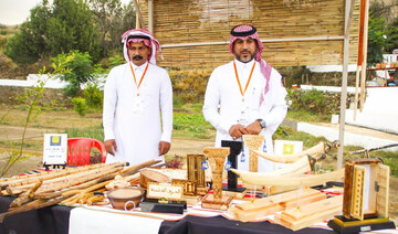 Mohammed bin Jamaan Al-Zahrani and Eida Ali Al-Zahrani, who hail from the Al-Baha region, are passionate about pyrography. (SPA)