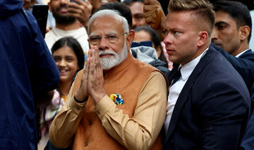 India’s Prime Minister Narendra Modi arrives for a wreath laying ceremony at the Monument to the Good Maharaja.