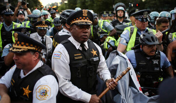 Police clash with demonstrators during a protest at the Israeli consulate during the Democratic National Convention on August 20