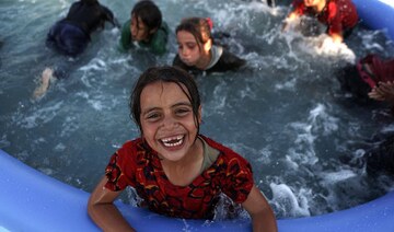 Mobile pools offer relief from heat to children in north Syria camps