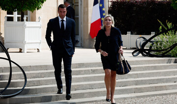 Macron meets Le Pen under pressure to name new PM