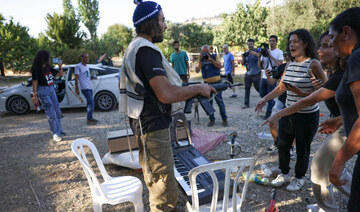 Activists confront settlers on land in al-Makhrour in the occupied West Bank near Beit Jala village on 22 August, 2024. (AFP)