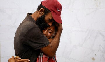 Mourners react during the funeral of Palestinians killed in Israeli strikes at Nasser hospital, in Khan Younis.