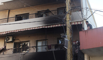 People inspect a home, damaged in an Israeli strike, in southern Lebanese village of Khiam on August 26, 2024. (AFP)