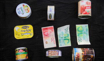 Canned products are displayed with 120 NIS ($32.81) illustrating how much they are worth in the local market in north Gaza.