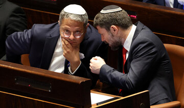 Israeli right wing Knesset members Itamar ben Gvir (L) and Bezalel Smotrich (R) chat at the Knesset in Jerusalem. (File/AFP)