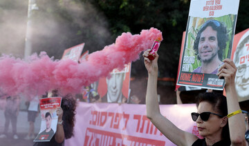 Protesters block a main road to show support for the hostages who were kidnapped during the deadly October 7 attack, in Tel Aviv