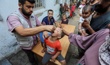 A Palestinian child is vaccinated against polio in Deir Al-Balah in the central Gaza Strip, September 4, 2024. (Reuters)