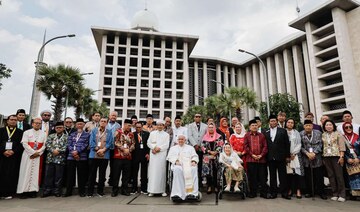 Pope Francis and Grand Imam of Istiqlal Mosque Nasaruddin Umar pose for a photo following an inter-religious gathering.