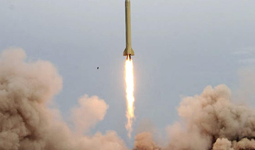 An Iranian Shahab-3 missile rises into the air after being test-fired at an undisclosed location in the Iranian desert. (AFP)