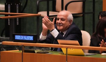 Palestinian representative Riyad Mansour applauds the result of the vote at UN Headquarters on September 18, 2024 in New York. 