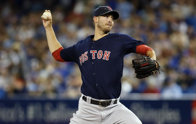 Lester, Red Sox rout sloppy Cards in Series opener