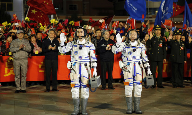 Chinese astronauts return to Earth after longest mission