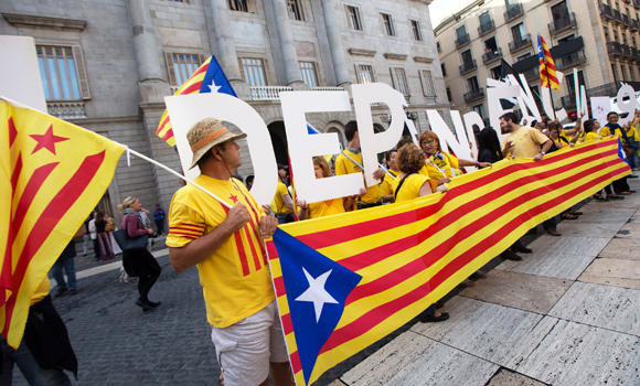 Catalonia defies Spain by calling secession vote