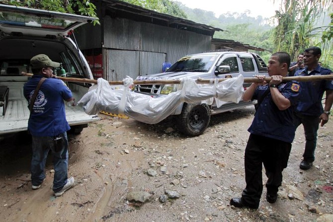 More bodies exhumed at graves in Thai ‘trafficking camp’