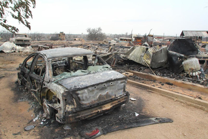 Rain calms California fire that jumped highway, burned cars