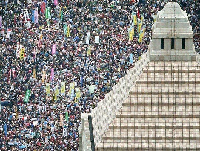 Tens of thousands protest over Japanese military law