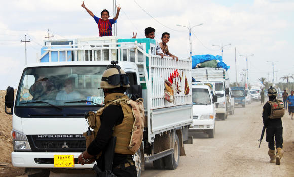 Thousands return to Iraqi city, where rebels were driven out