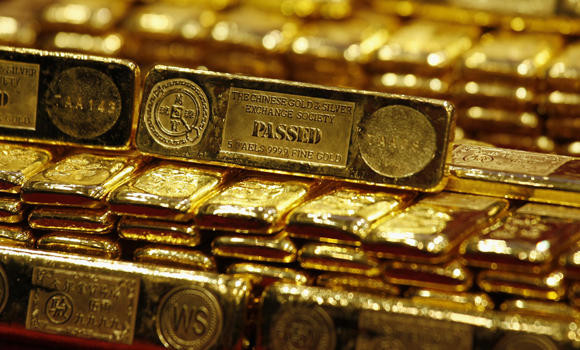 Gold drops on firmer dollar