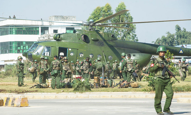 China calls for cease-fire as thousands flee Myanmar border town