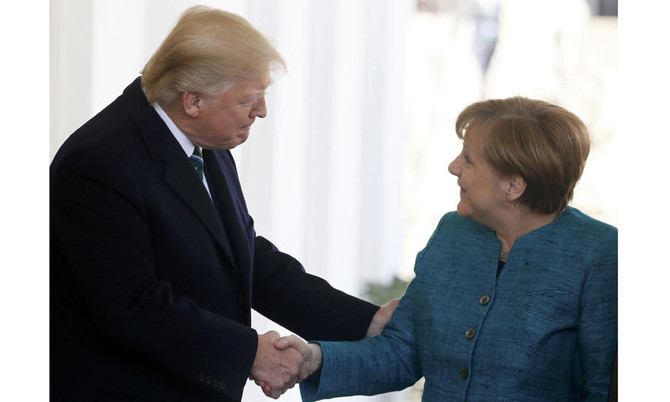 Tensions show as Trump, Merkel meet for first time