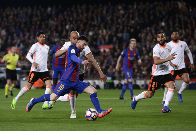 Messi double edges six-goal thriller Barca’s way