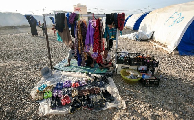 Near Mosul, soldiers and displaced meet at the spa