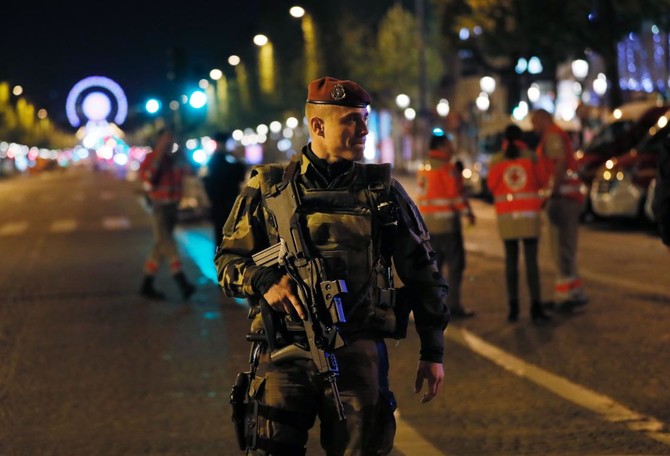 Tourists venture back to Champs Elysees after attack