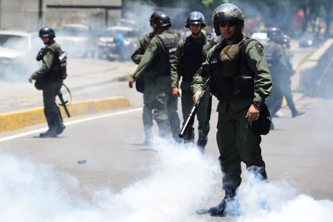 Venezuela death toll hits 29, protesters battle security forces