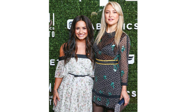 Kate Hudson, Demi Lovato team up for workout clothes