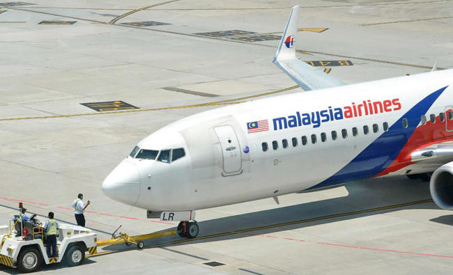 Passengers subdue man trying to enter cockpit of Malaysia Airlines