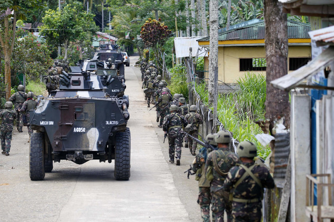 Philippine flag raised on Independence Day in war-torn city