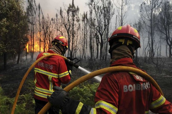 Portugal in mourning as firefighters still battle deadly wildfire