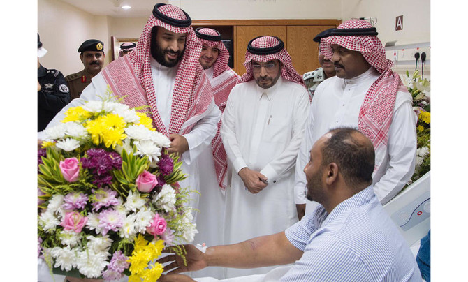 Crown prince visits injured security men who thwarted plan to target Grand Mosque