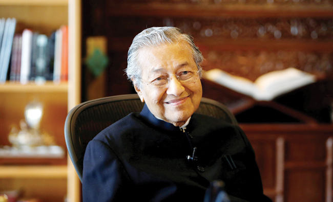Malaysia’s Mahathir says would back old foe Anwar as prime minister