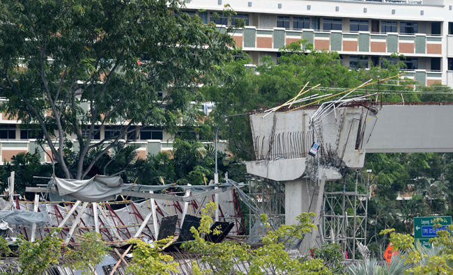 One dead as under-construction Singapore highway collapses