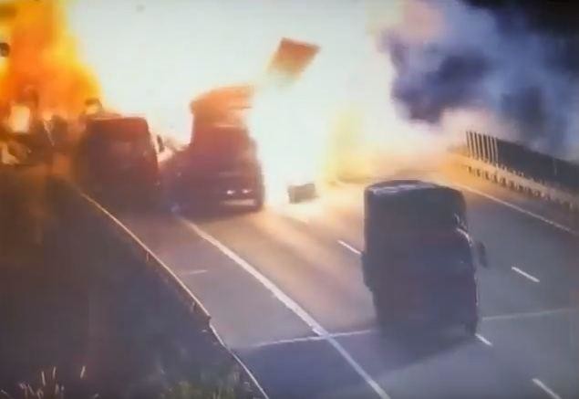 VIDEO: Lorry explodes in ball of flames after clipping stationary vehicle