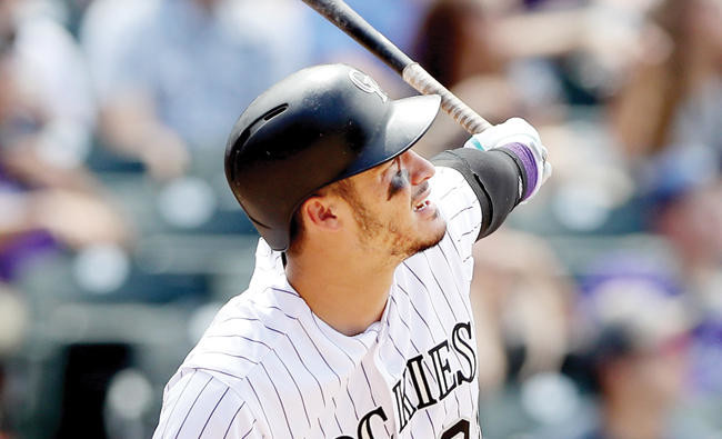 Nolan Arenado hits three homers in Rockies' 18-4 rout of Padres