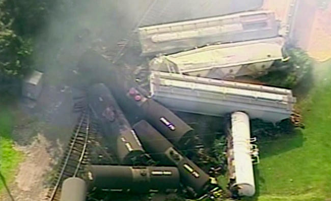 Town evacuated after freight train derails, catches fire