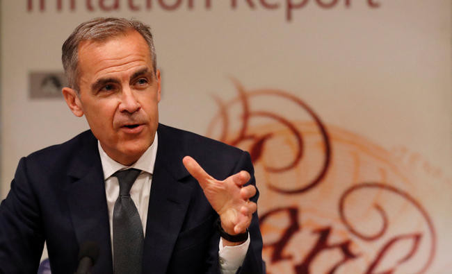 Bank of England leaves rates on hold, cuts growth forecast, still hints at 2018 rise