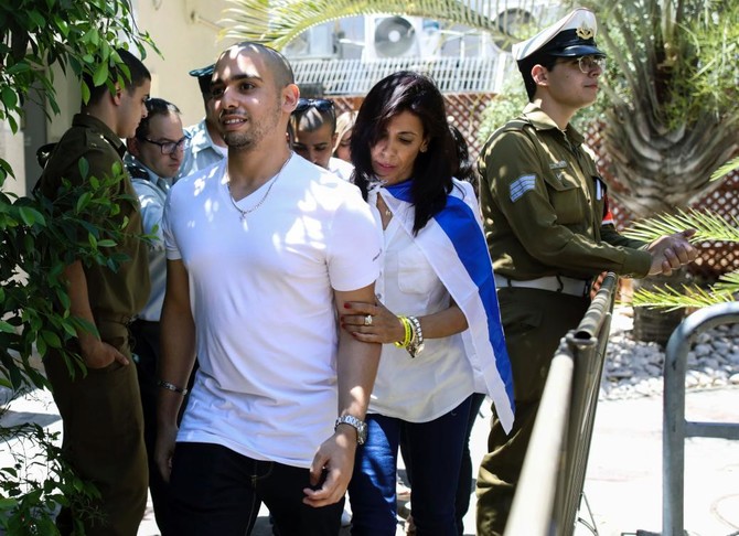 Israeli soldier in fatal shooting of wounded Palestinian begins prison term