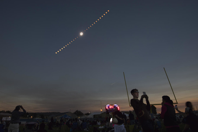 Mother of all photobombs? Twitter erupts as space station sneaks into snap of the eclipse