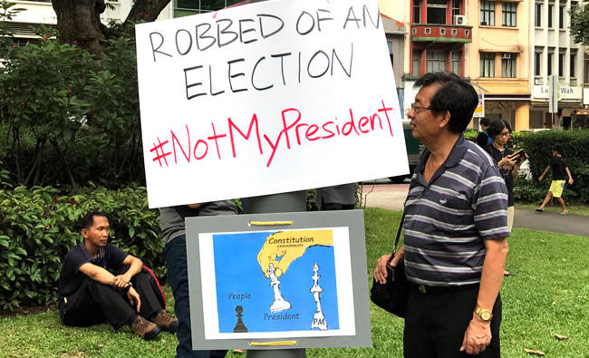 Singaporeans protest against uncontested presidential election