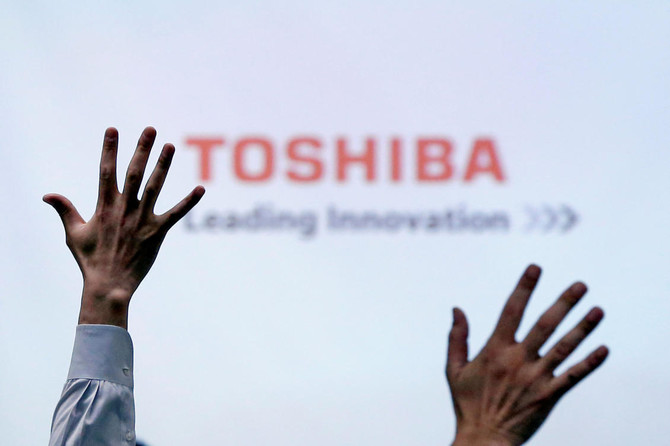 Toshiba signs deal to sell chip unit to Bain-led group for $18 billion