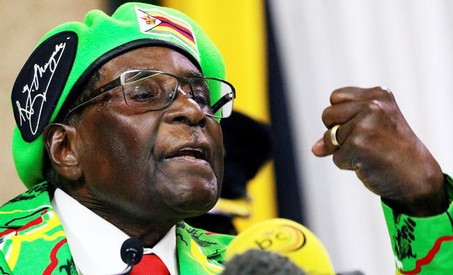 Mugabe threatens to sack VP as wife booed at rally