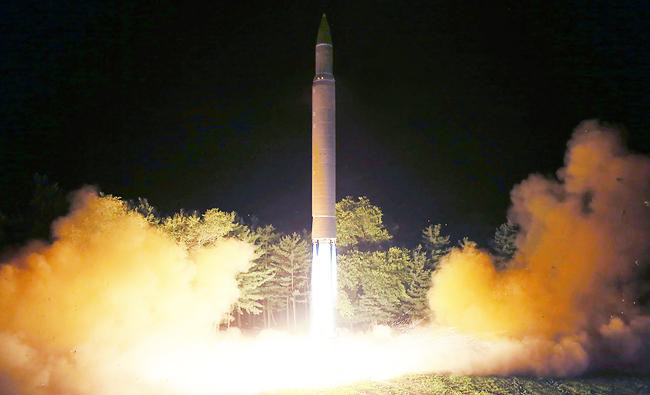 North Korea says successfully launched new missile that can reach all US